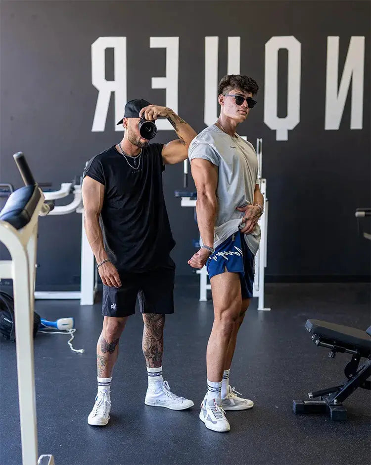 Two pairs of Trend men's mesh quick-dry gym shorts by Simples Market in blue and black athletic jogger style