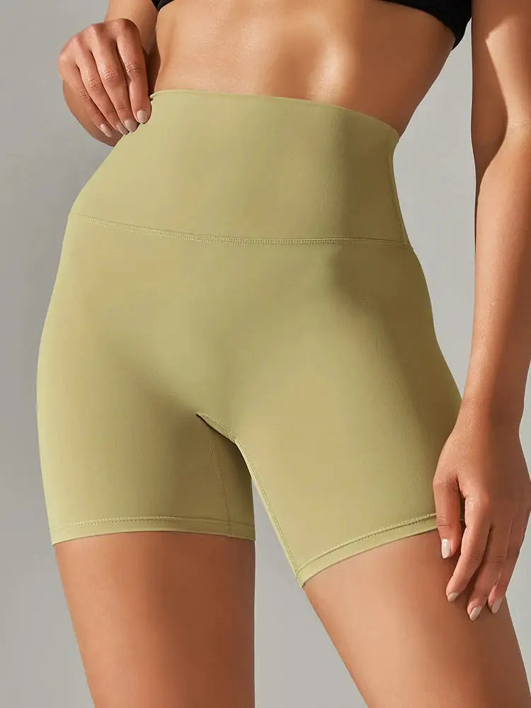 Women high-waist yoga shorts in pale olive, stretchy seamless fabric