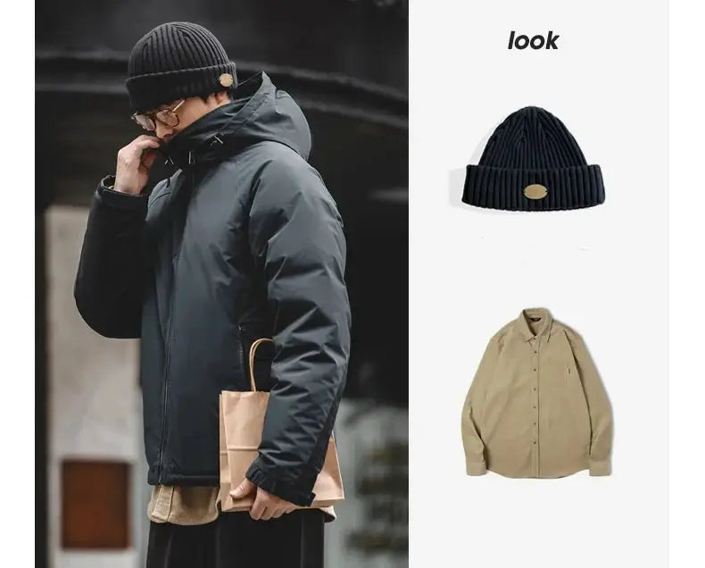 Maden hooded down jacket for men in black; matte-glossy parka fabric; 3 pieces shown: jacket, navy beanie, beige shirt