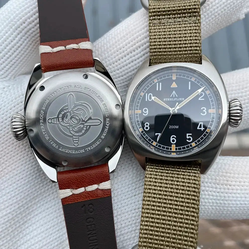 Steelflifer SF745 wristwatches pair; black dial with luminous markers, 200M water resistance, khaki fabric & brown leather straps.