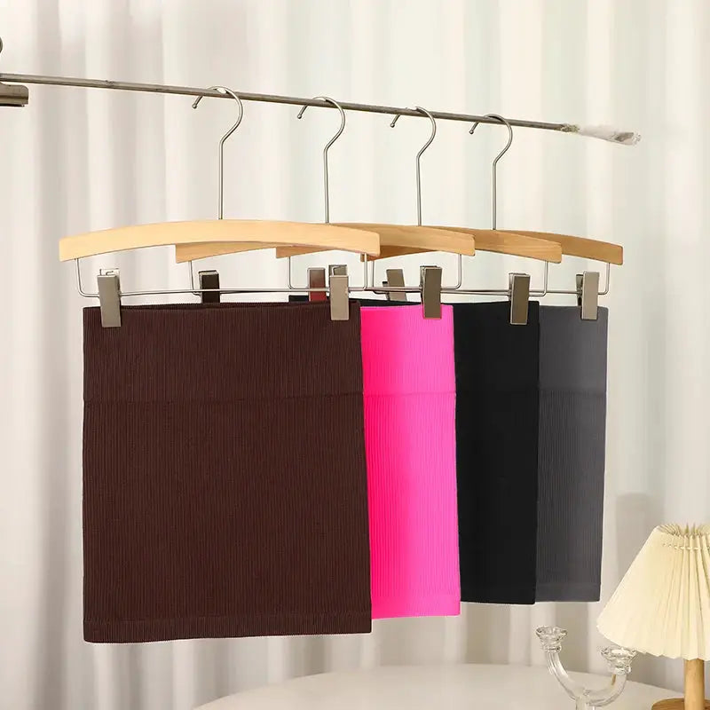 Knitted high-waist mini skirts, 4-piece set in brown, pink, black and gray on hangers