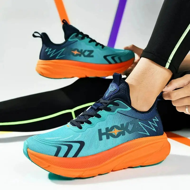 Pair of men's running shoes in teal breathable mesh with bright orange cushioned midsole.