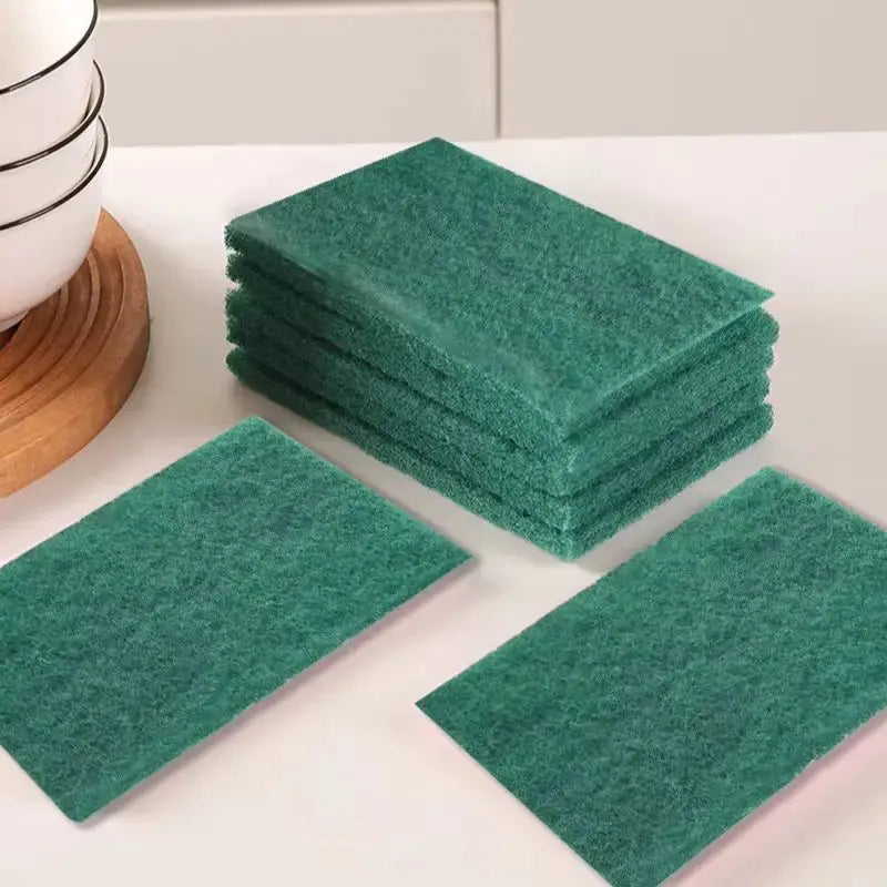 Green kitchen scrub pads bundle for oil removal and dishwashing; reusable, scratch-free.