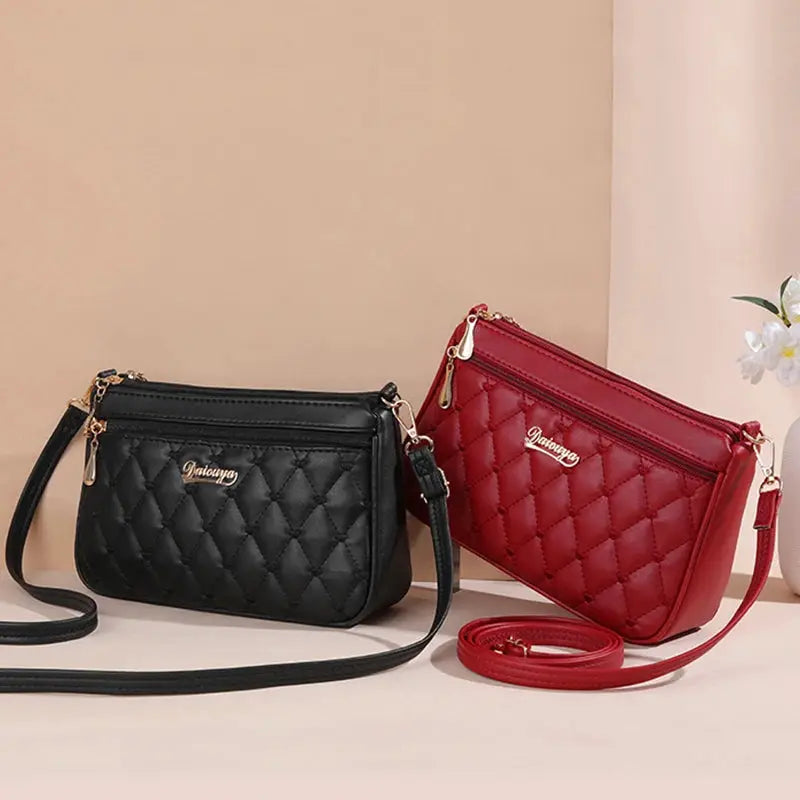 PU leather quilted crossbody bags in black and red with gold zippers, two bags by Simples Market.