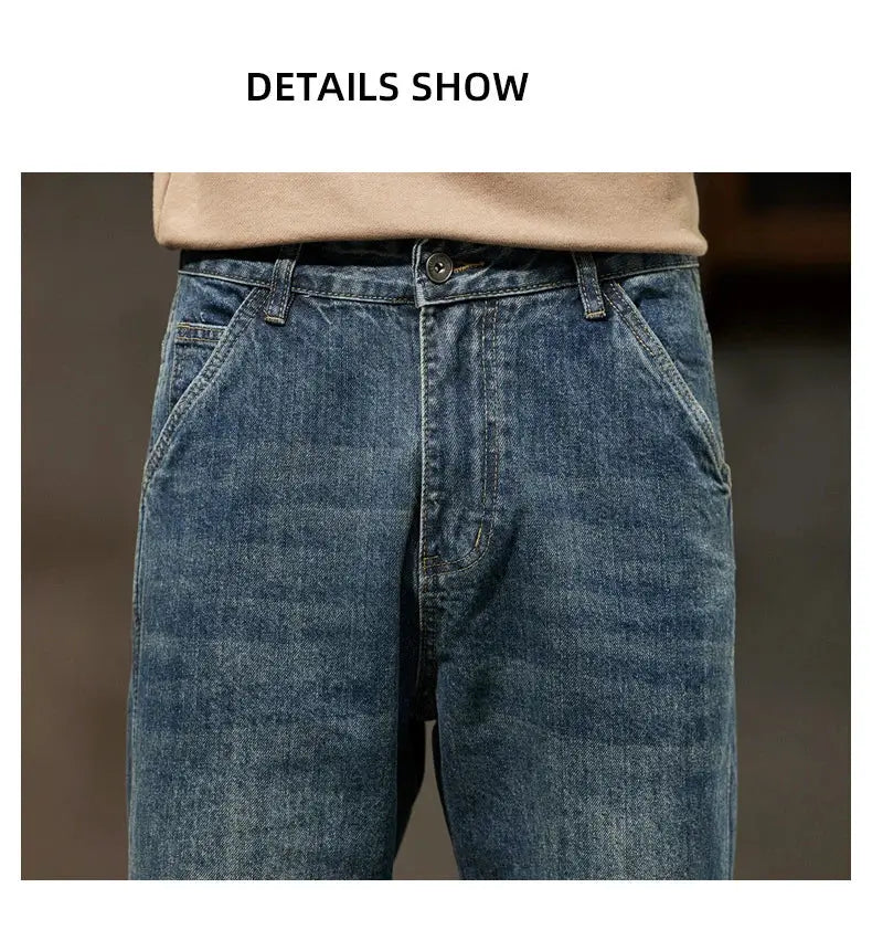 Men's blue denim jeans with front pockets and button fly; loose, straight-leg style.
