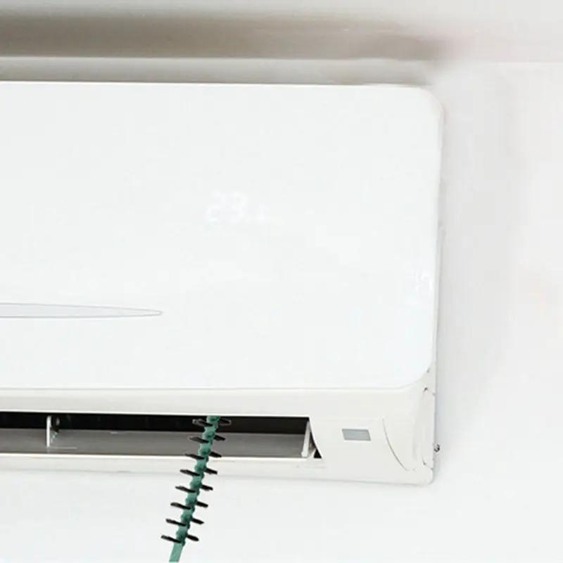 Deep cleaning brush for washing machine with green bristles against a white appliance