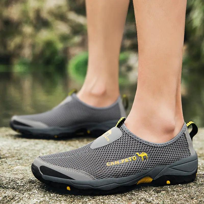 Men's gray mesh slip-on outdoor shoes with breathable upper and yellow accents.