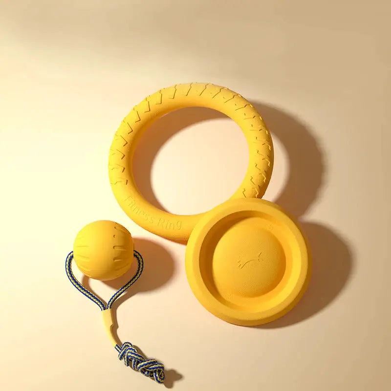 Yellow EVA dog toy set with ring, flying disc, and ball with blue rope