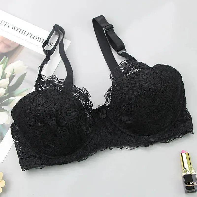 Simples Market black lace bra with scalloped edges and bow detail, adjustable straps