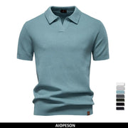 Men's solid teal blue golf polo shirt with breathable honeycomb knit and short sleeves.