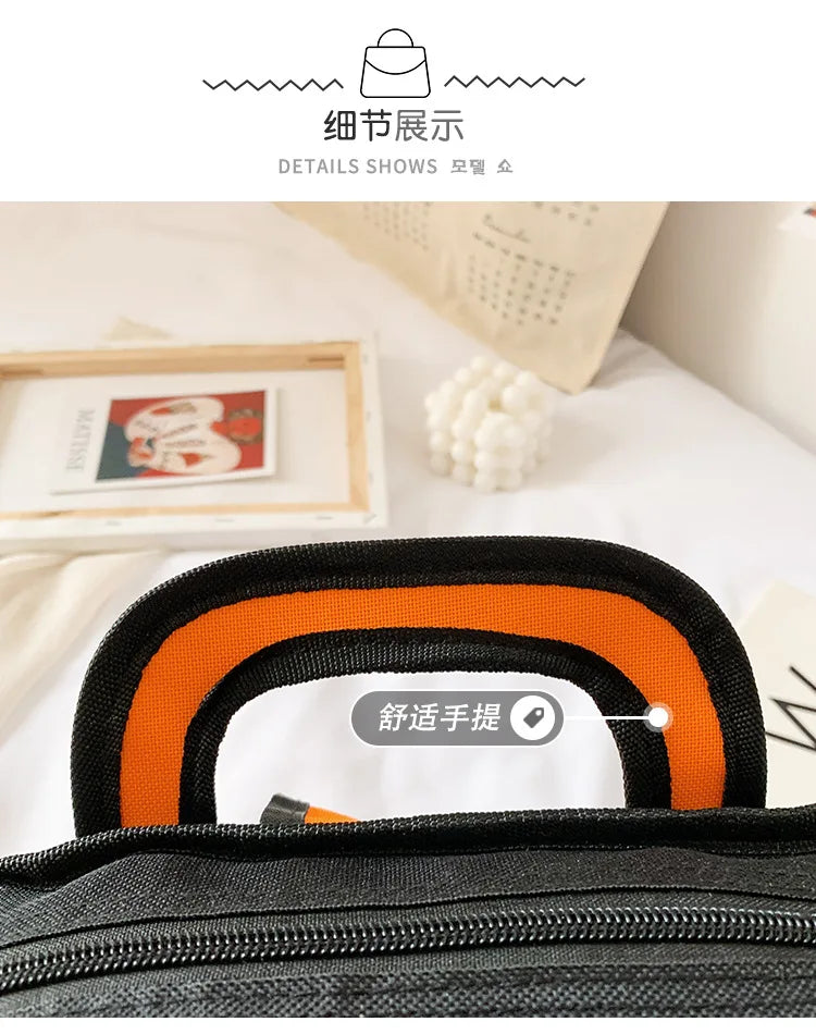 Backpack for kids with orange and black curved handle, ideal for primary school.