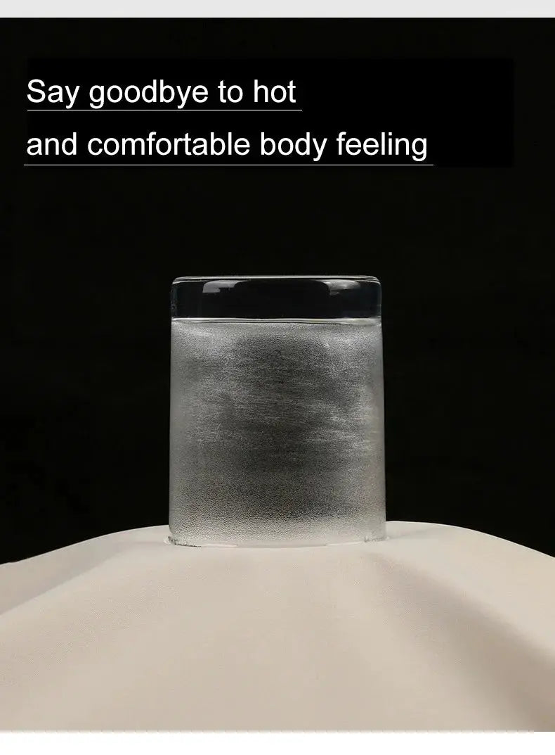 Frosted glass of water on a white surface against a black background