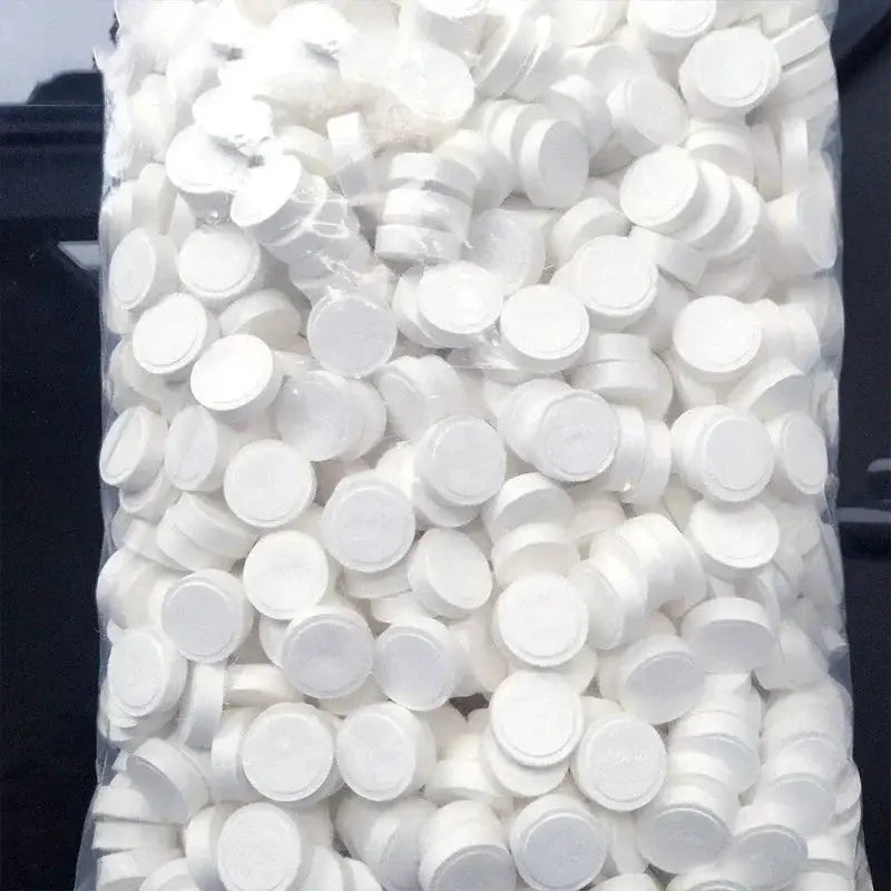 Compressed towels in a bag of white non-woven round discs for travel and camping.