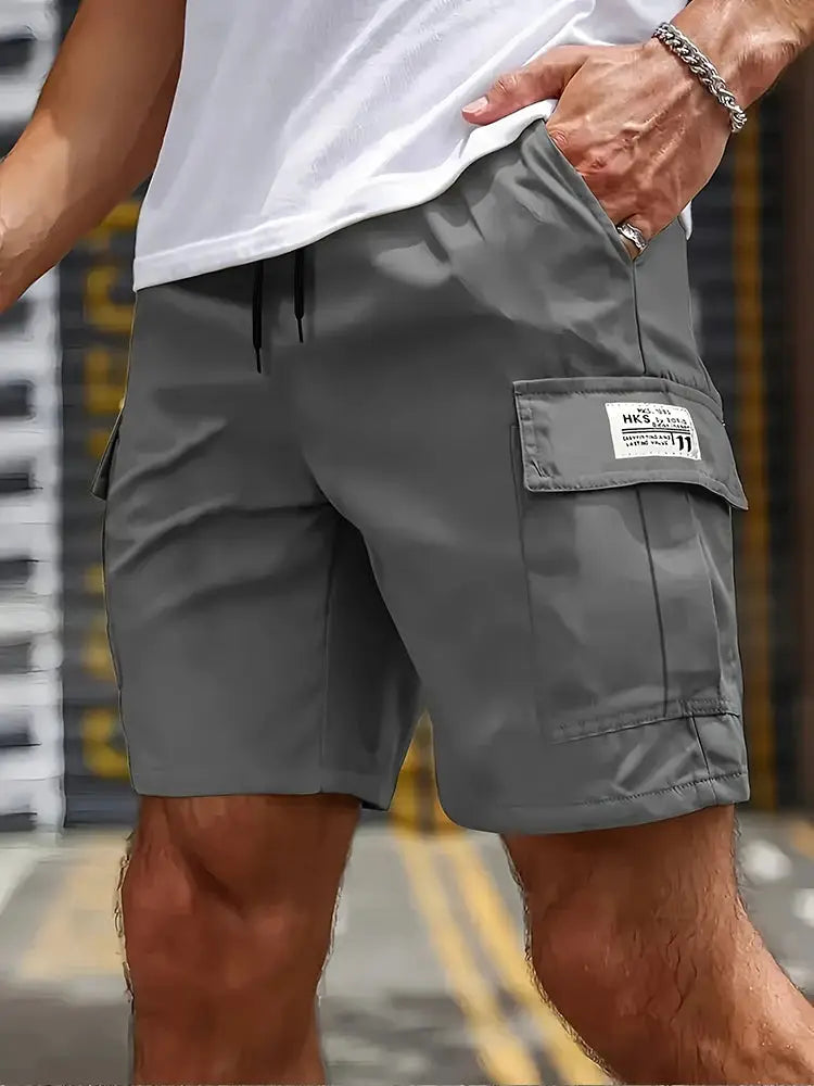 Men's grey cargo shorts with large side pocket; drawstring waist, knee-length, casual workwear by Simples Market.