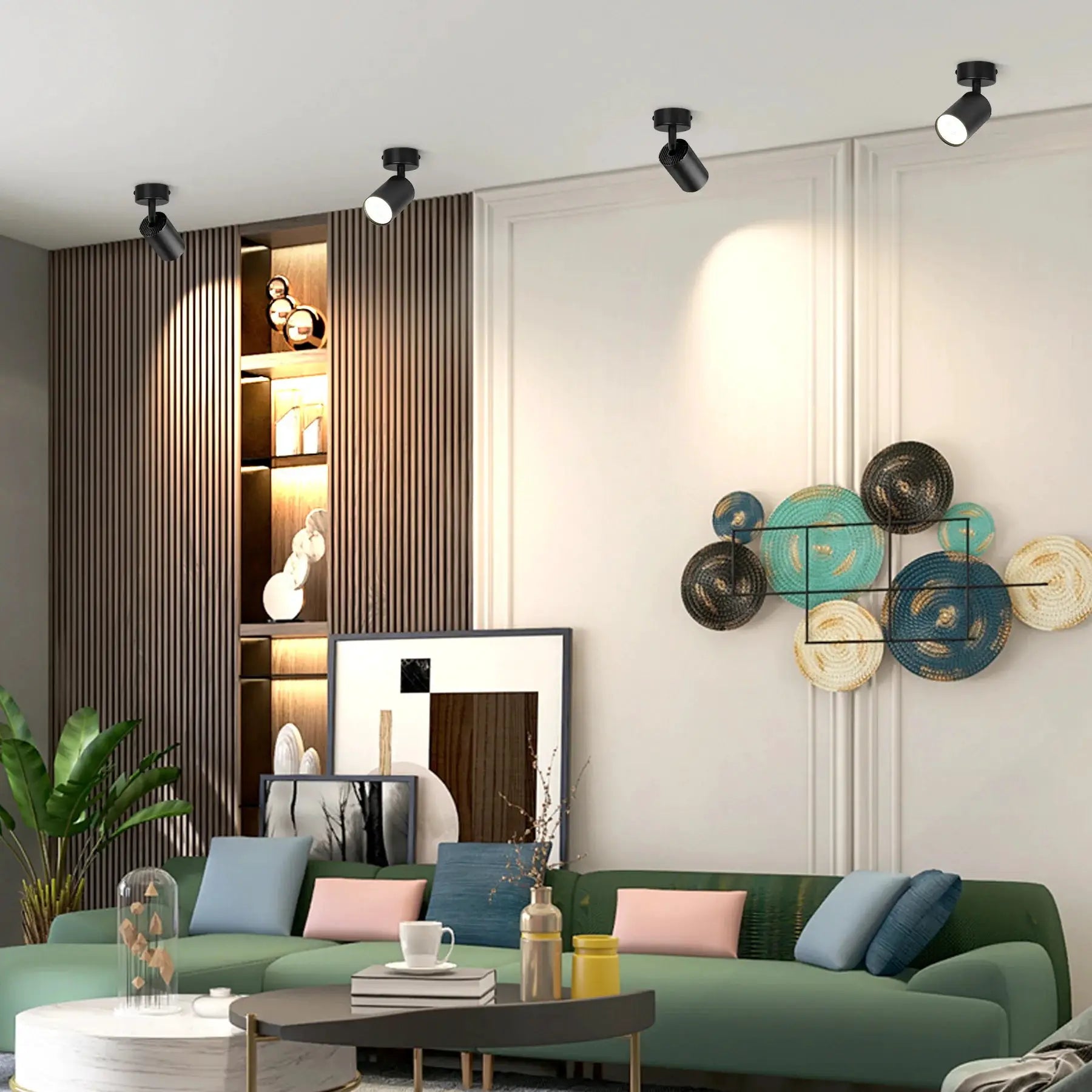 LED ceiling spot lamps; four black cylindrical fixtures with GU10 bulbs on a white ceiling in a modern living room.
