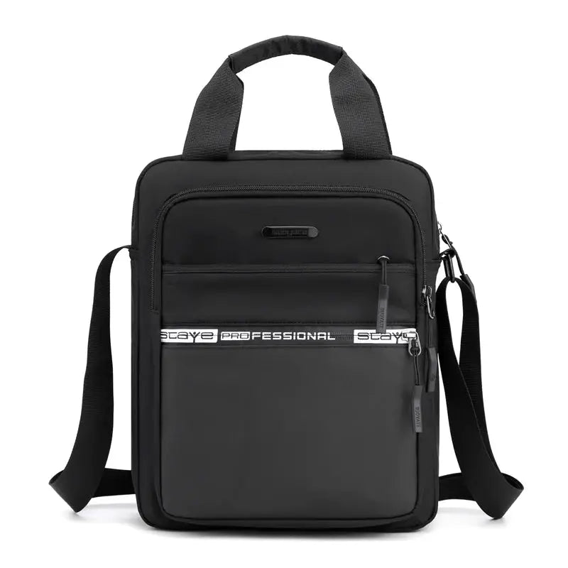 Men's black crossbody bag by Simples Market with adjustable shoulder strap and front zip pockets.