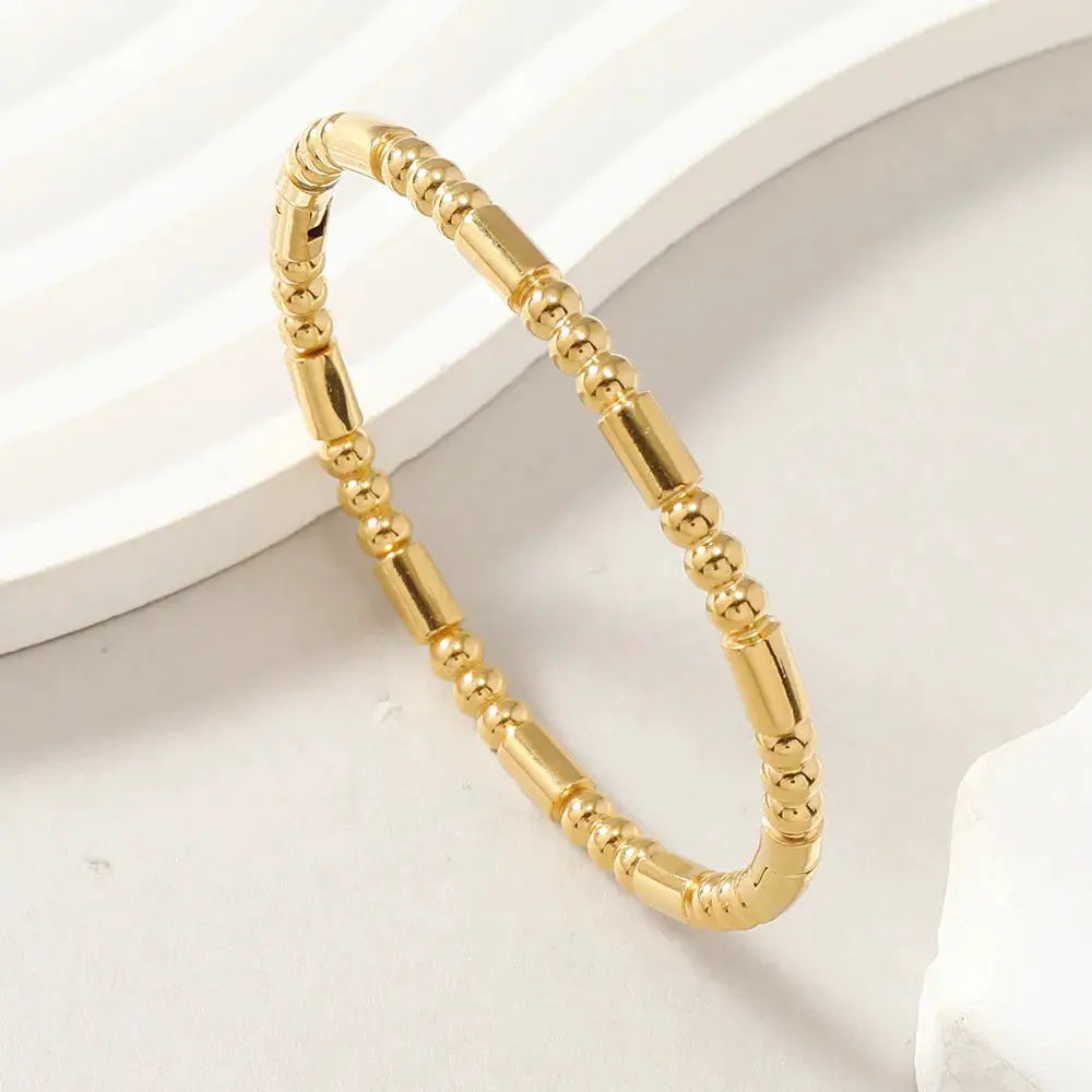 Gold-tone stainless steel open cuff bracelet for women with beaded and cylindrical segments