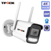 4K IP outdoor WiFi security camera by TP-TEK, white bullet-style with two antennas and wall mount.