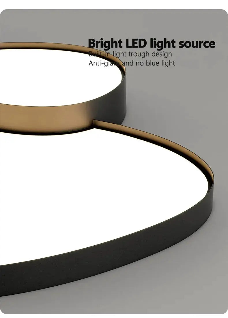 LED ceiling lamp by Simples Market, black with gold interior, circular dual-ring design