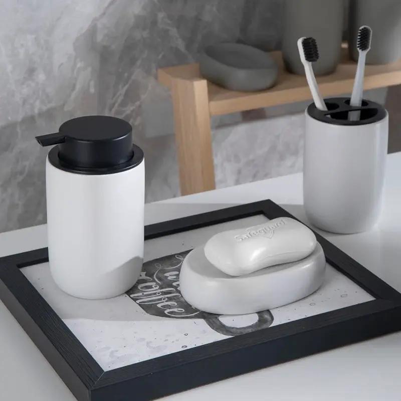 Bathroom set, Simples Market ceramic four-piece in white/gray: pump bottle, mouthwash cup, toothbrush holder, soap dish.
