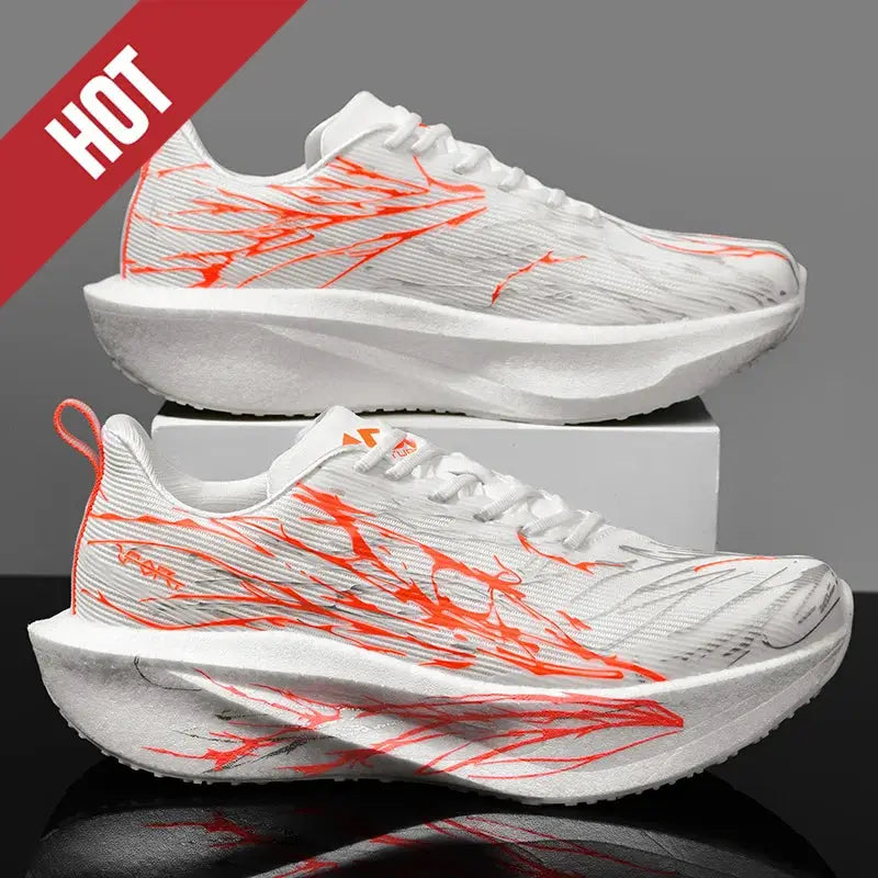 Running shoes, white with orange graphic accents, breathable foam sole, two shown