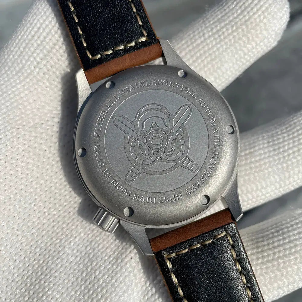 STEELFLIER SF752 mechanical dive watch; stainless steel caseback with logo, black leather strap with white stitching.