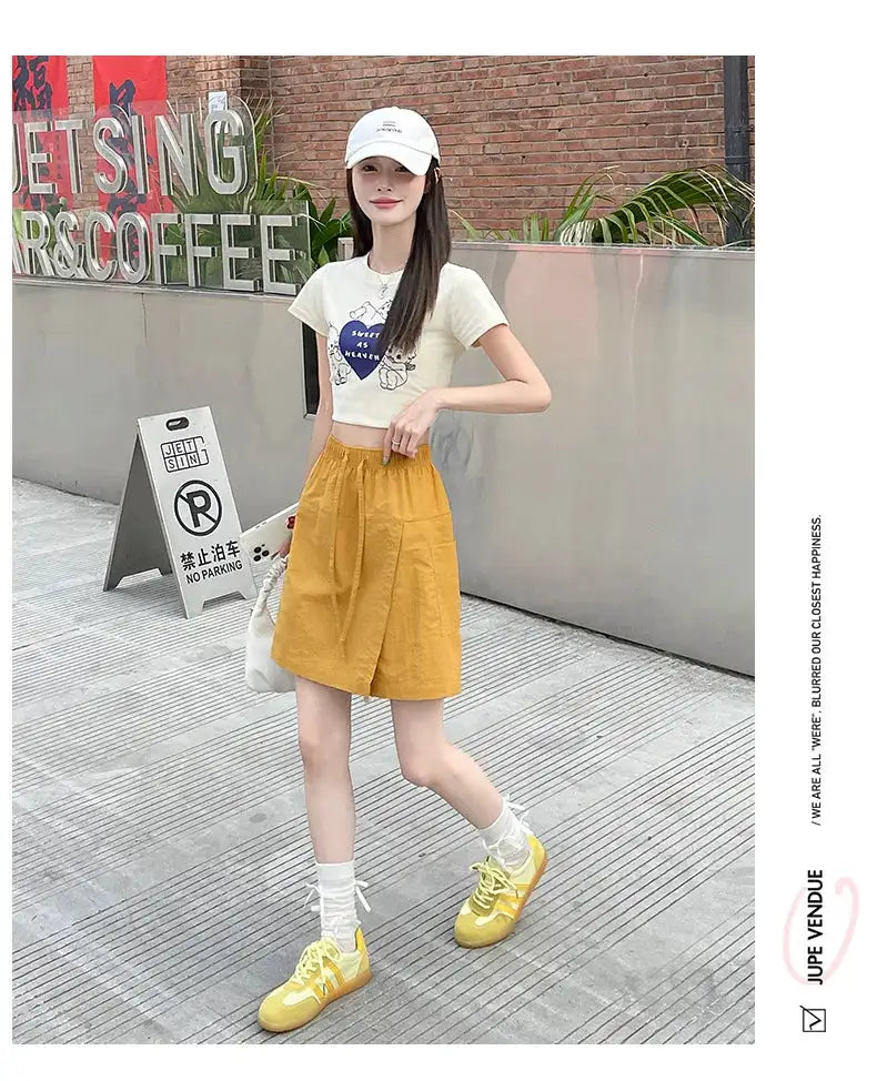 Women's shorts-skirt set by Simples Market; mustard yellow high-waist A-line shorts for summer