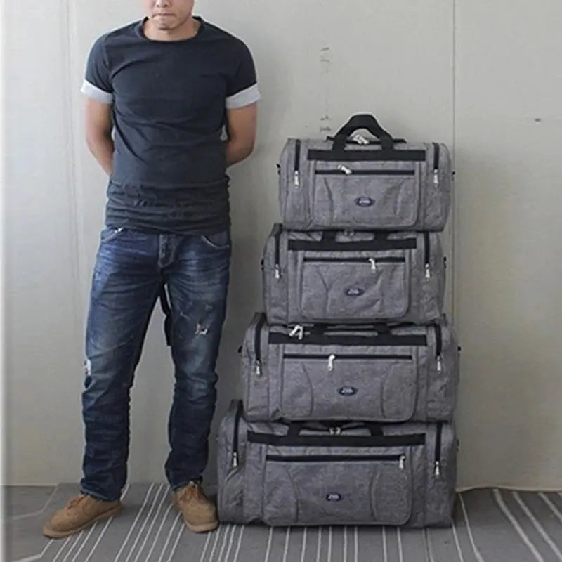 Men's travel luggage set by Simples Market; four gray Oxford waterproof duffle bags stacked, large-capacity with top handles