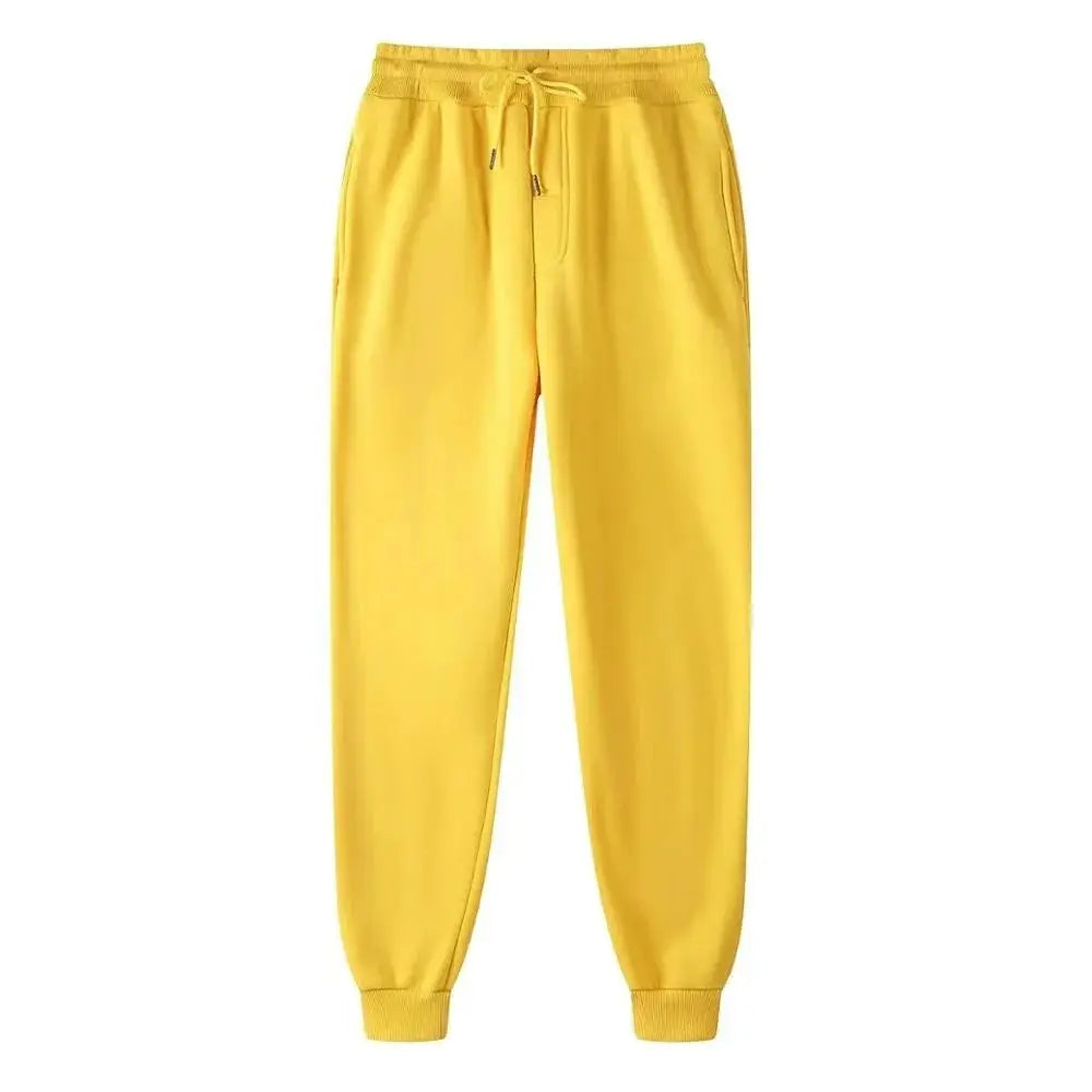 Men's yellow jogger pants by Simples Market with drawstring waist and cuffed ankles