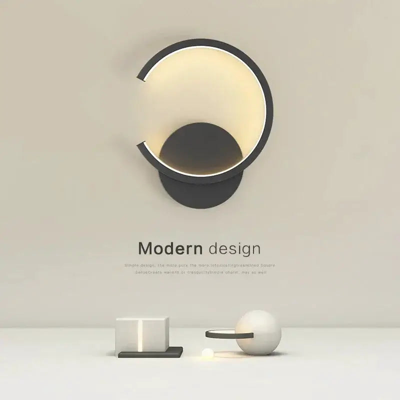 Modern LED wall lamp with black circular ring and warm golden glow, Nordic style