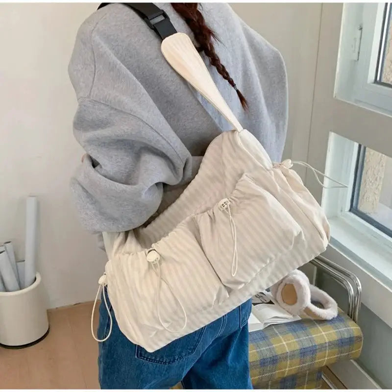 Simples Market Korean nylon shoulder bag, cream striped design with drawstring closures, crossbody style.