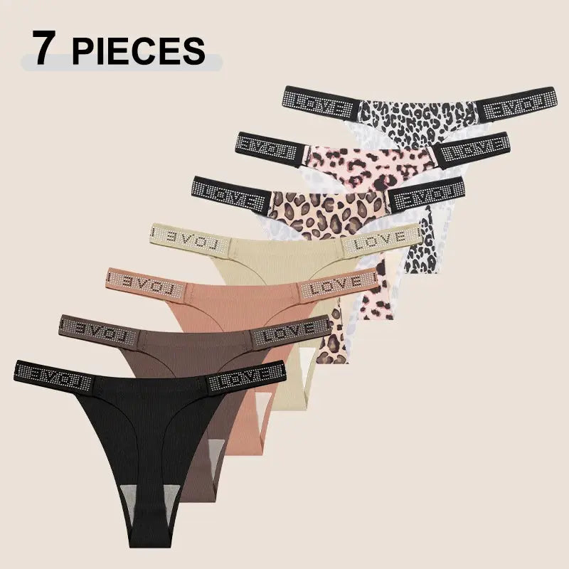 7-piece women's low-rise thong set in assorted colors, including leopard prints, with crystal-letter waistbands