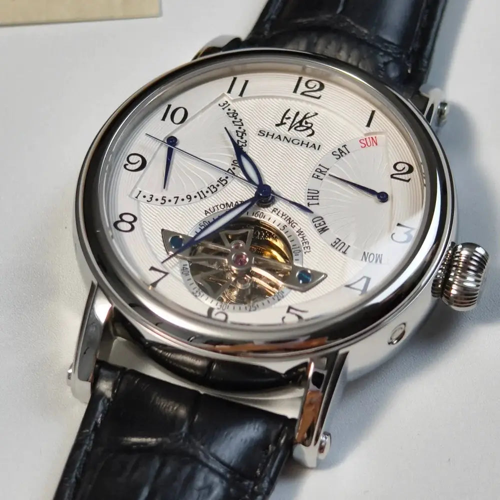 Shanghai 42mm automatic wristwatch with white dial, blue hands, open-heart movement, black leather strap