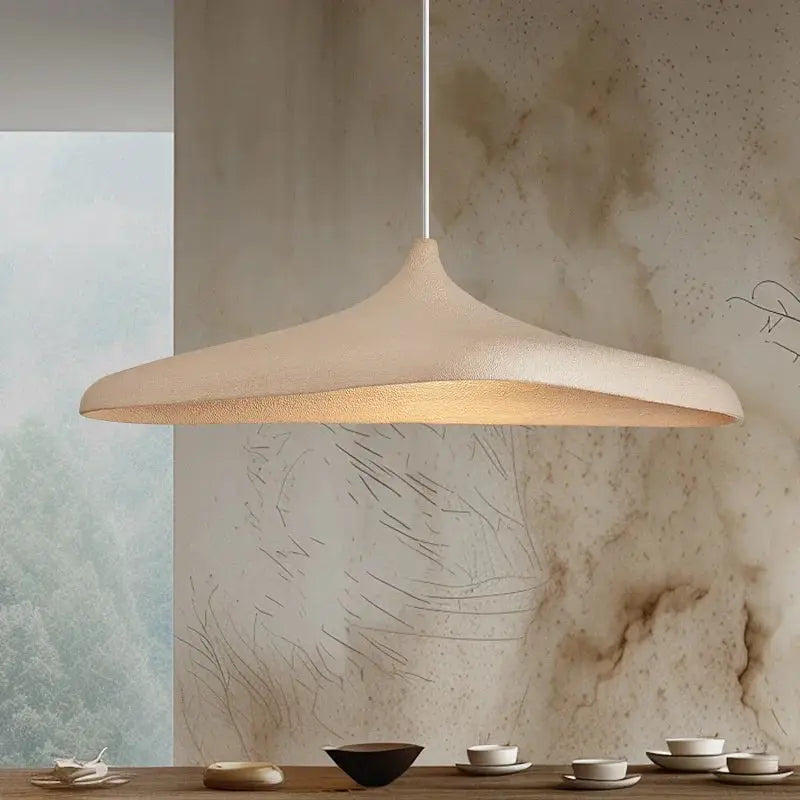 Japanese Wabi Sabi style LED pendant light by Simples Market, beige ceramic shade with warm glow.