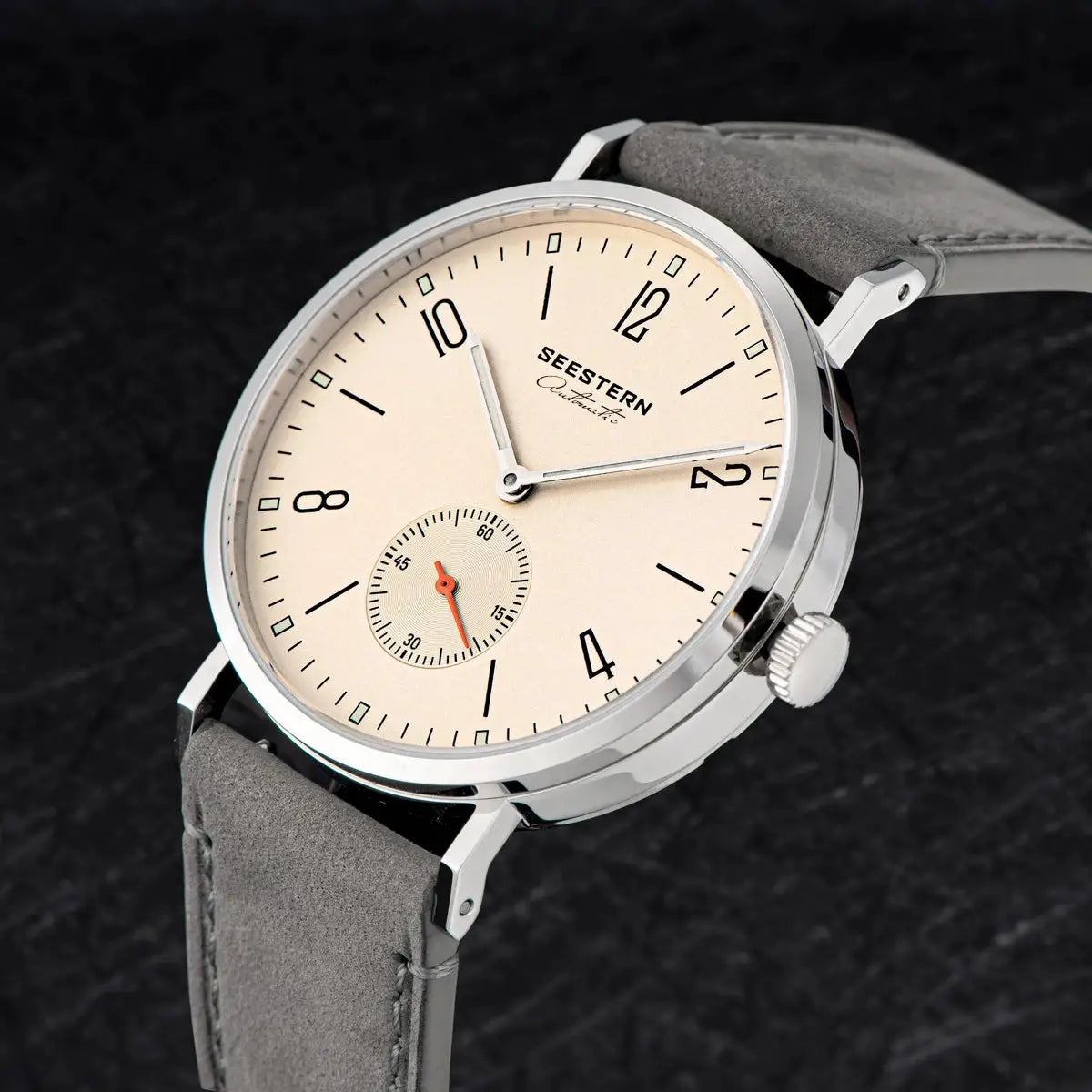 SEESTERN men's automatic wristwatch with beige dial, silver case, gray suede strap.