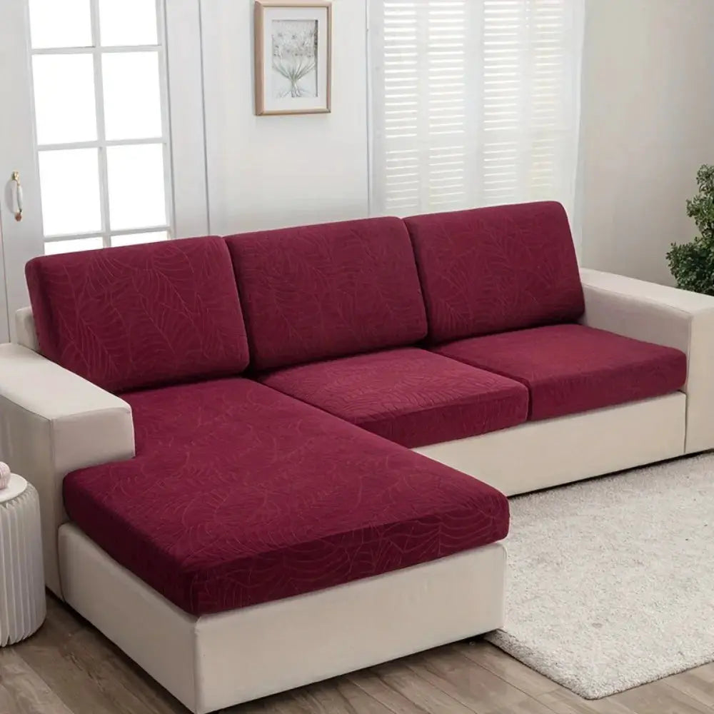 Waterproof stretch sofa cushion cover; burgundy jacquard on a white sectional with chaise by Simples Market