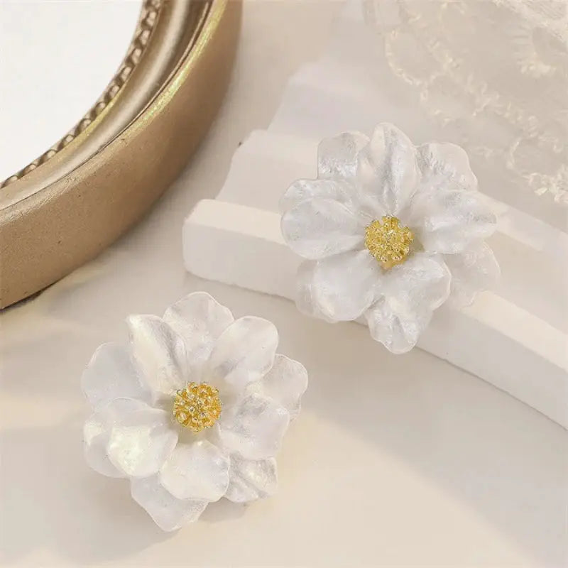 2 white flower dangle earrings with acrylic enamel petals and yellow centers