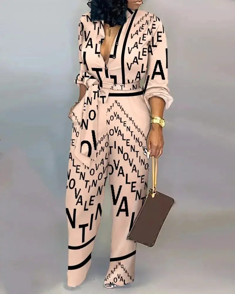 Women’s beige letter-print long-sleeve jumpsuit with belt and button-front for streetwear elegance.