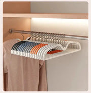 Short-neck non-slip clothes hangers by Simples Market; white with color accents, space-saving closet rod set