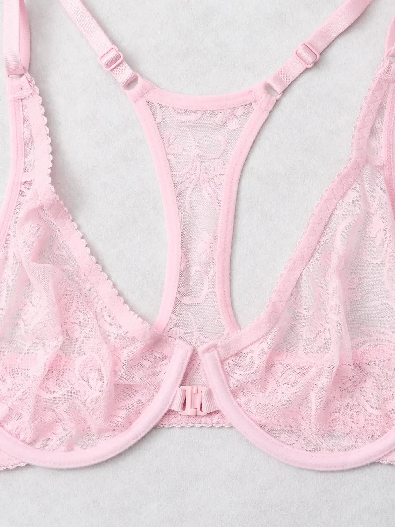 Pink lace sheer bra with floral pattern, adjustable straps and front center closure