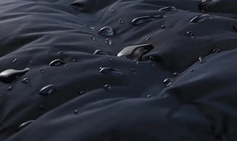 Men's navy duck-down puffer jacket; water-repellent shell with water droplets