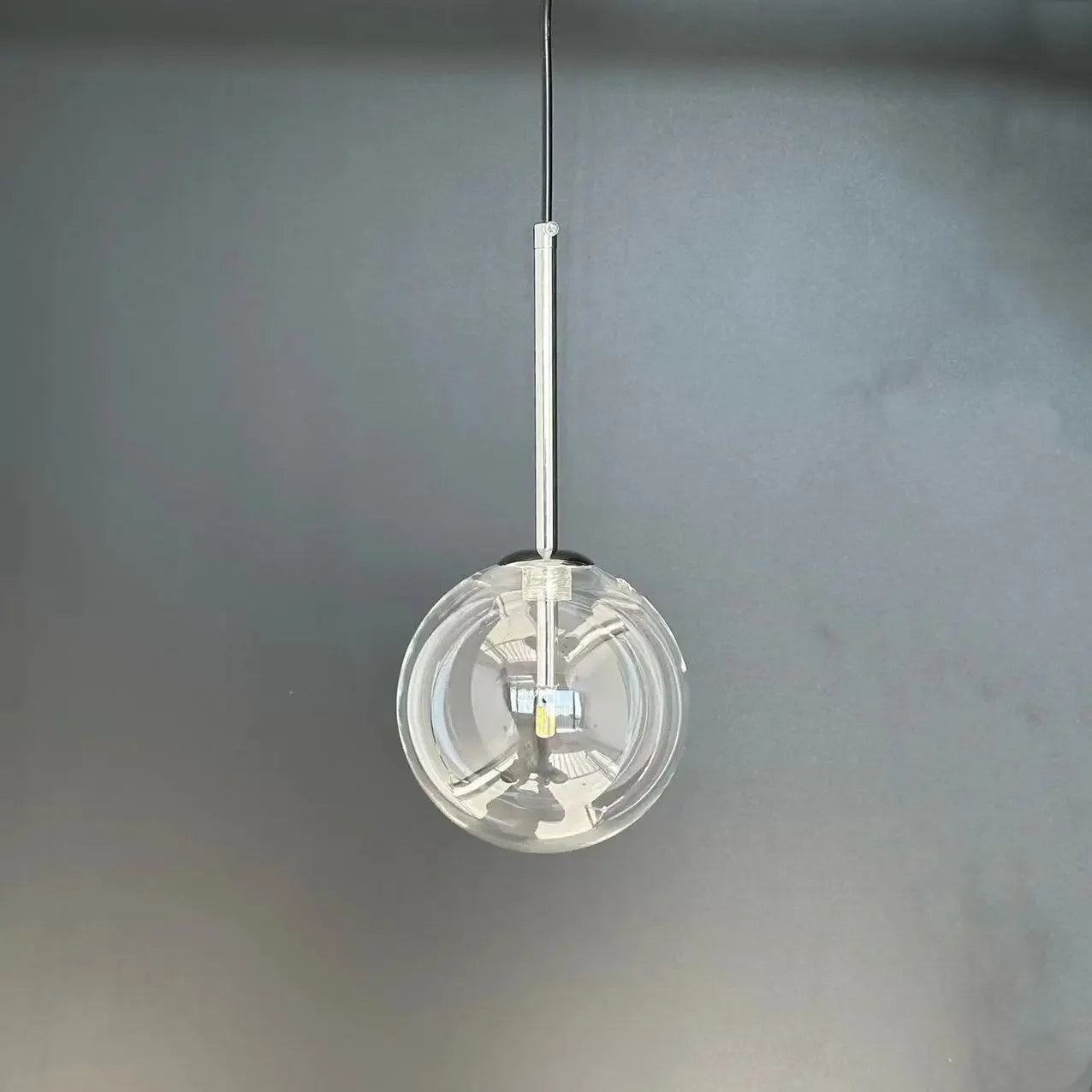 LED pendant lamp with a clear glass globe, chrome suspension, modern Nordic decor