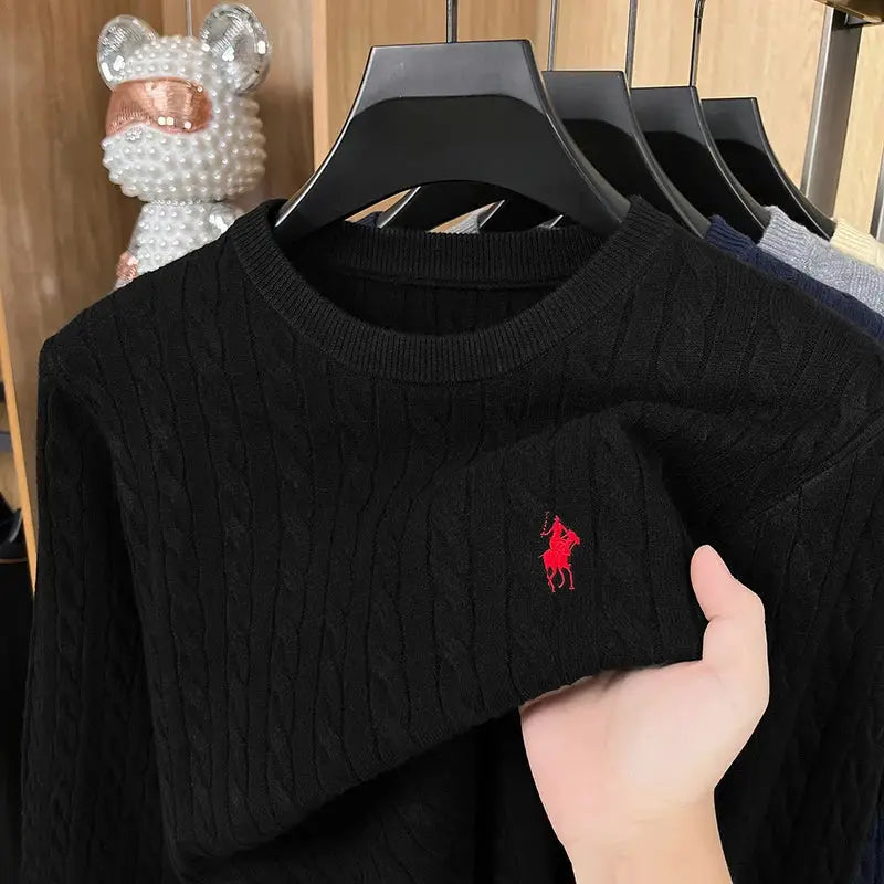 Men's black long-sleeved cable-knit crewneck sweater with red polo pony logo; part of a multi-color set.
