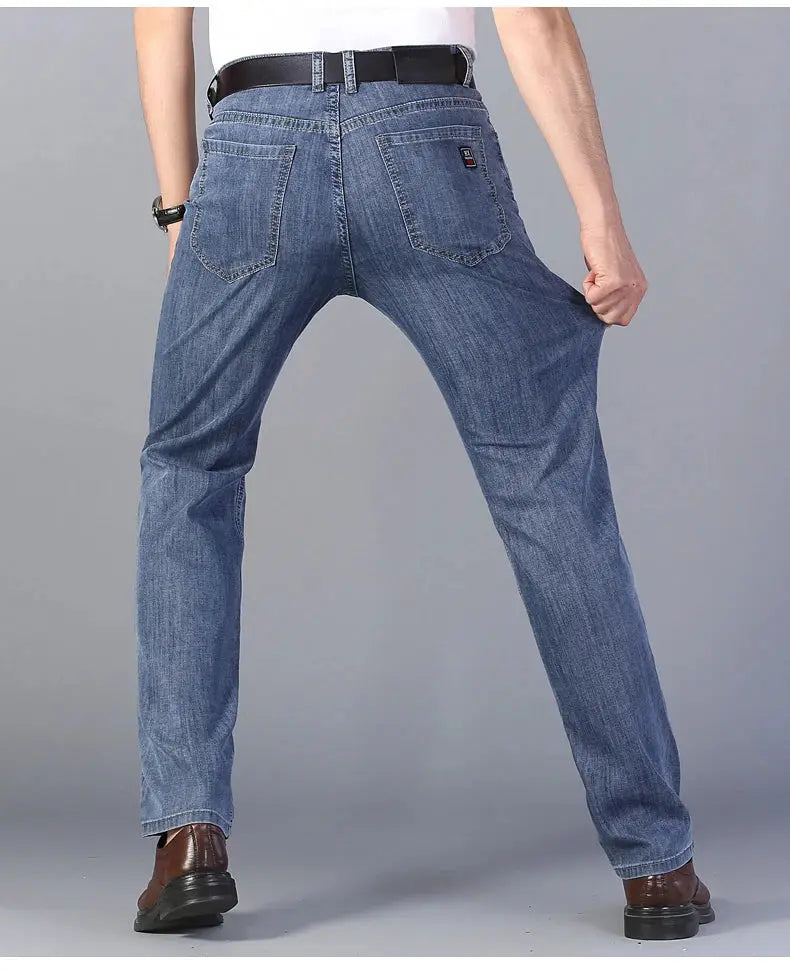 Men's light-blue stretch denim jeans with back pockets and a belt, straight-leg casual trousers for everyday wear.
