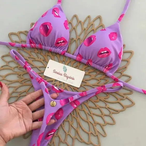 Women's purple lip-print bikini set with triangle top and G-string bottom for beachwear.