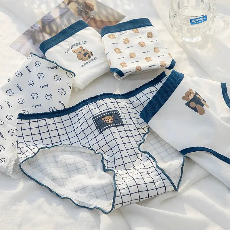 5-piece cotton panties set with cartoon bear prints, mid-waist briefs in white with navy trim, Simples Market for girls.