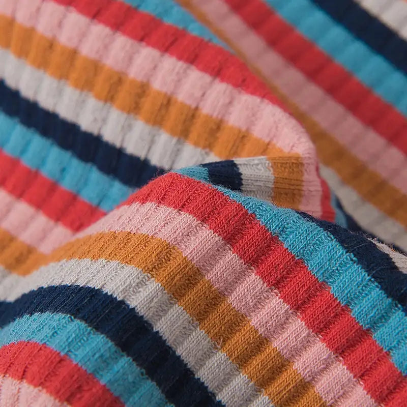 Women's cotton panties rainbow striped fabric close-up with colorful ribbed knit texture