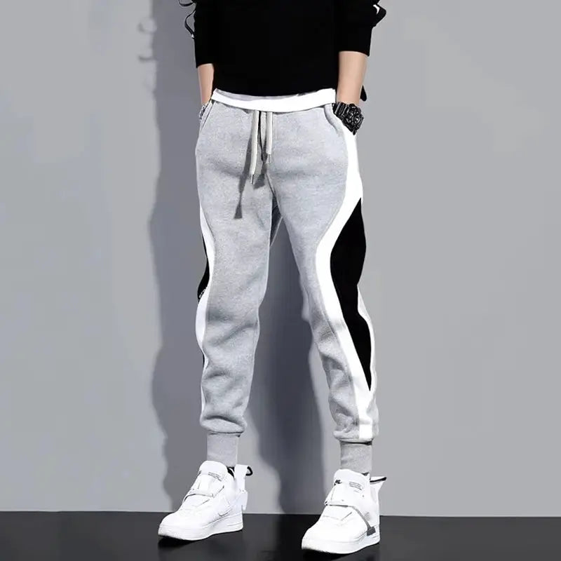 Simples Market men's patchwork jogger pants; grey with white and black side panels, drawstring waist, cuffed ankles