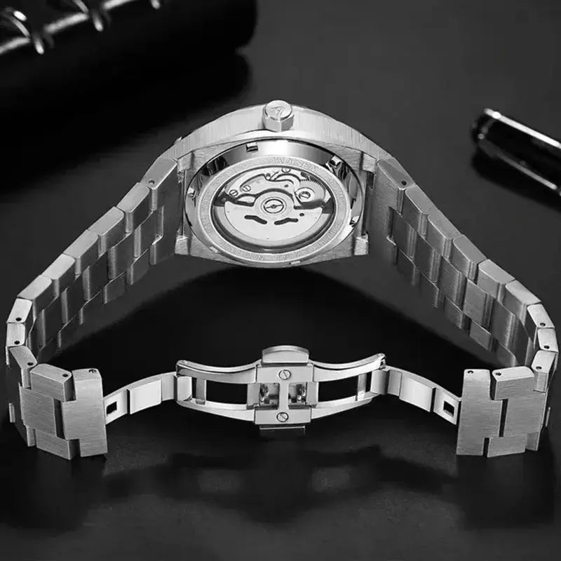 Men's stainless steel skeleton automatic watch with butterfly deployment clasp and exhibition case back.