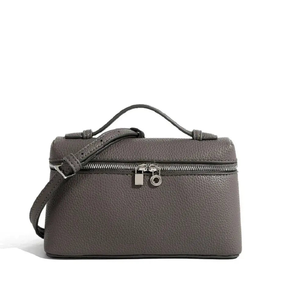  Mini taupe pebble-grain shoulder bag with top handle and crossbody strap, silver zippers.